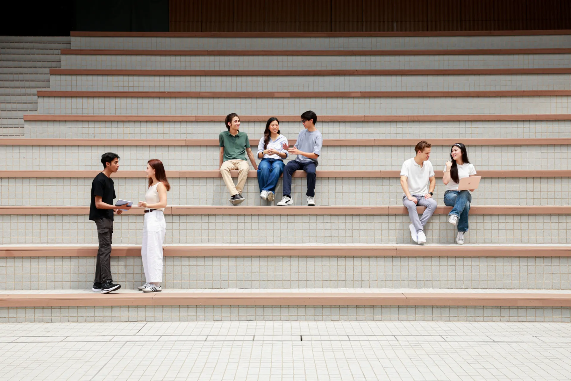 Students sitting on steps at CityUHK